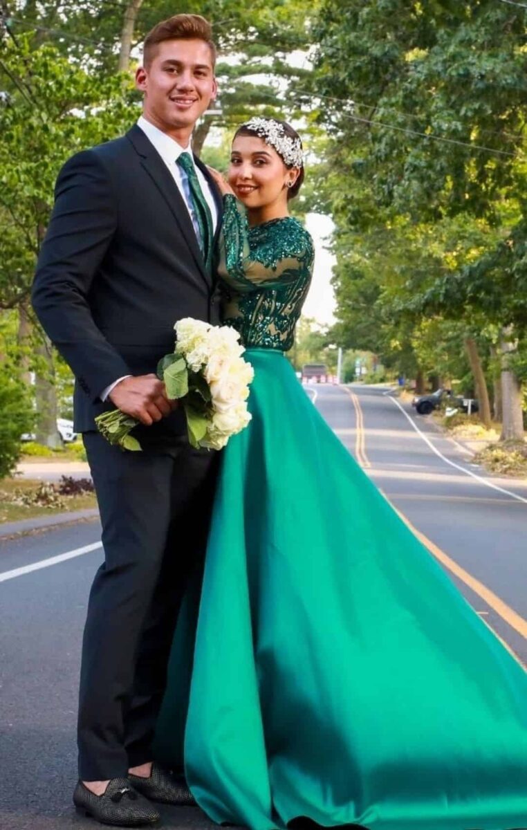A Bride And Groom Pose For A Picture In A Green Prom Dress.