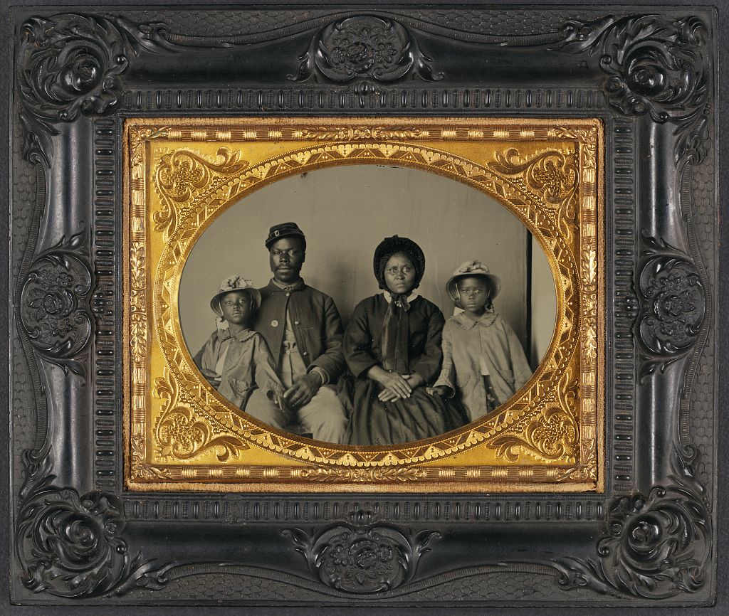 A Family Photo In A Historic Frame.