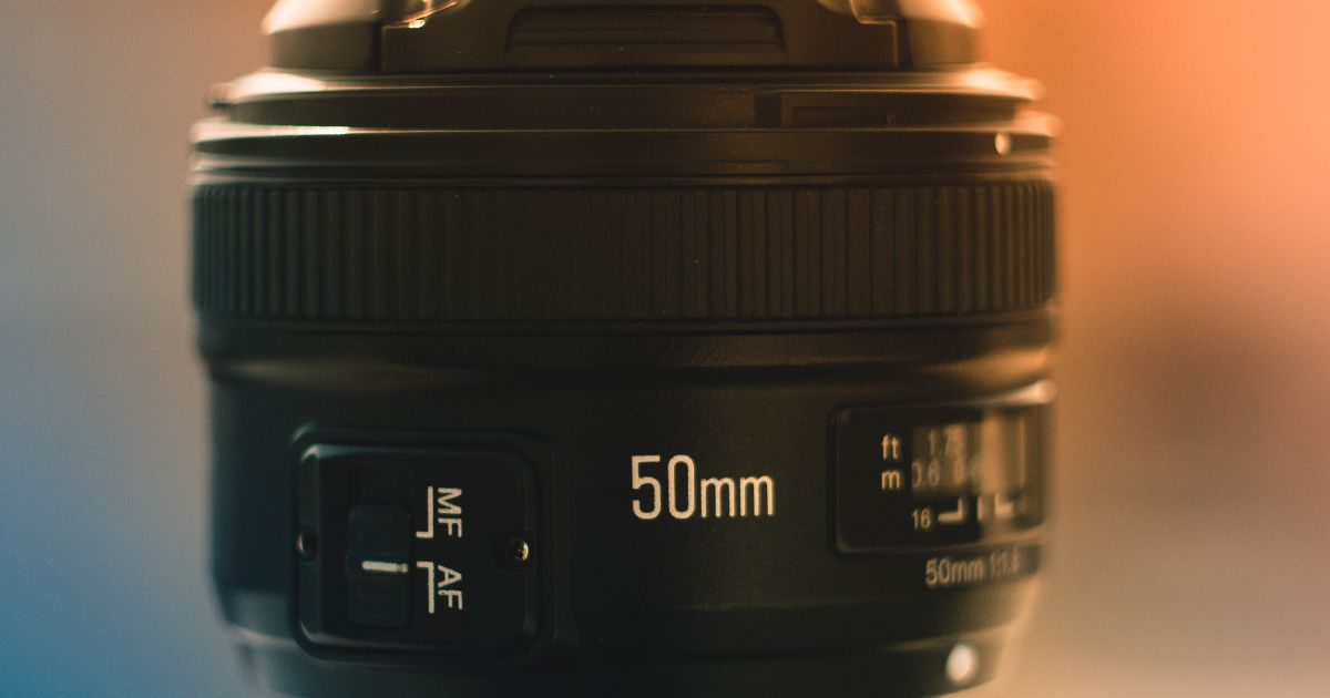 A Close Up Of A Camera Lens With A Blurred Background, Perfect For Beginners In Photography.