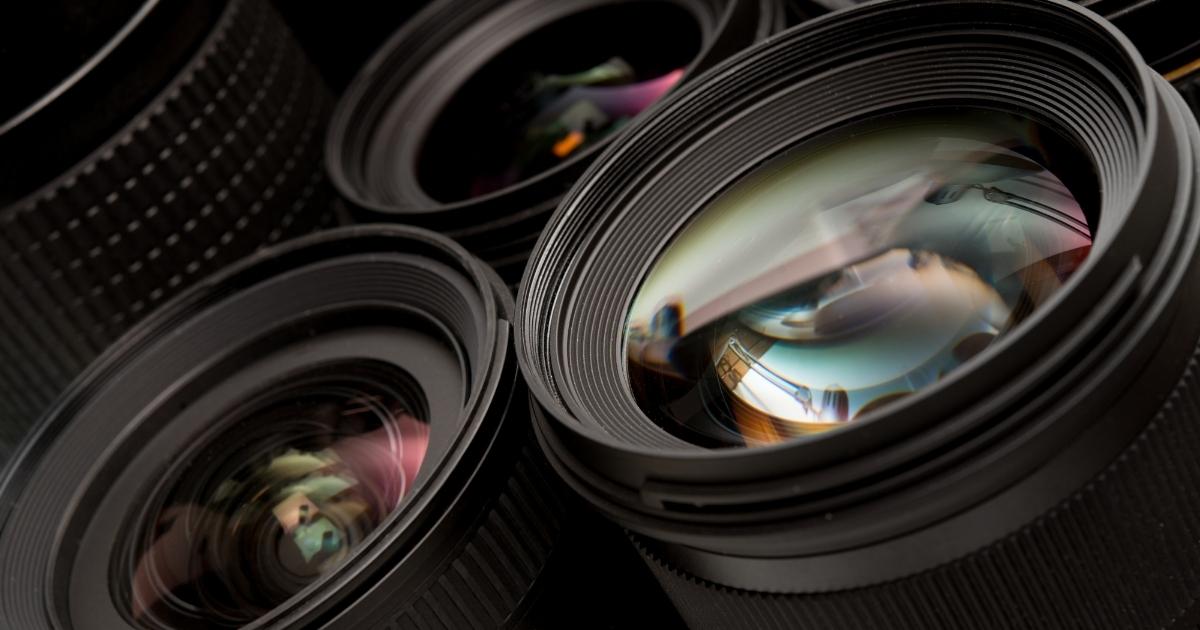 A Collection Of Camera Lenses On A Dark Background, Showcasing The Essence Of Photography.