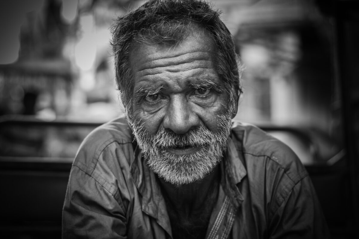 A Black And White Photo Capturing The Essence Of An Old Man, Showcasing Why Photography Is Important.