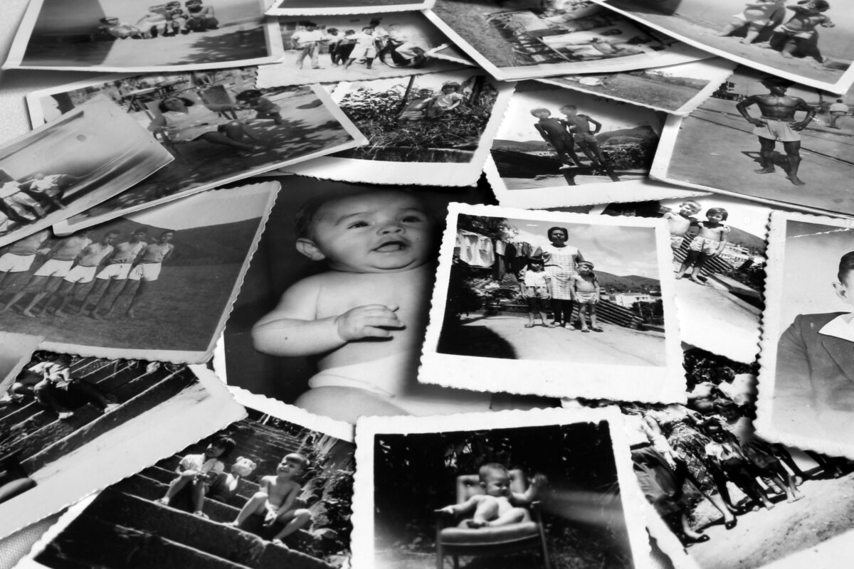 A Pile Of Old Photos Highlighting The Importance Of Photography.