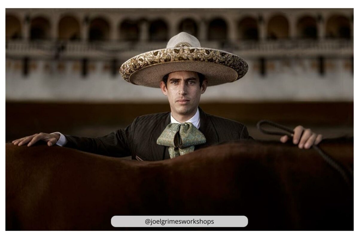 There Is A Man Wearing A Mexican Hat Showcasing His Pose Alongside A Horse, Highlighting The Reason Why Photography Is Considered An Art.