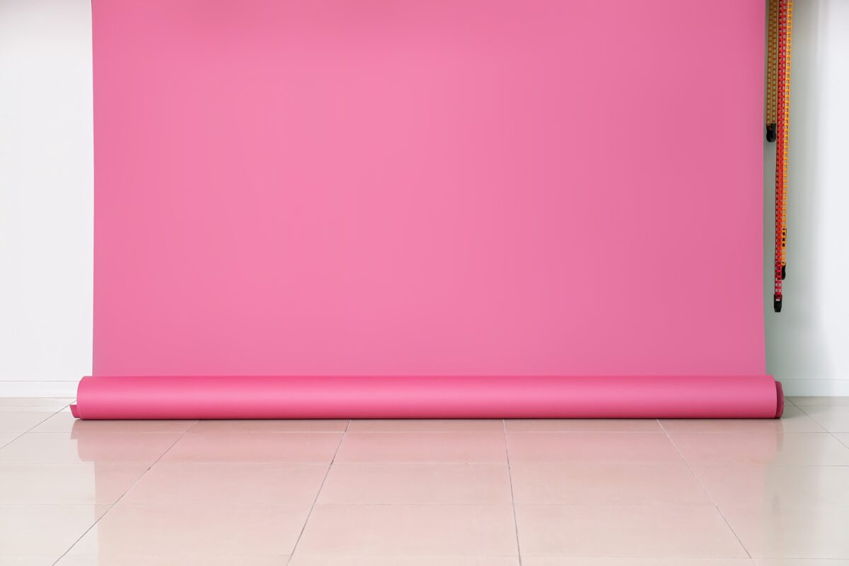 A Pink Wall, Serving As A Photography Backdrop, In An Empty Room.