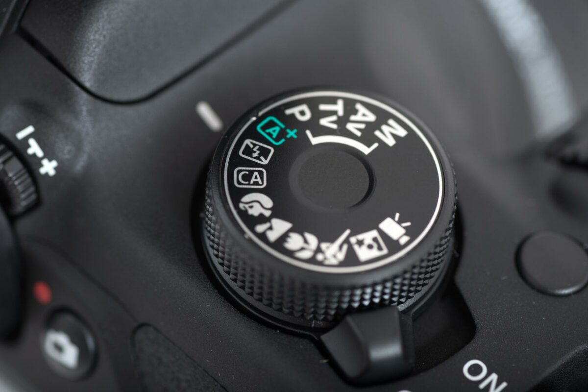 A Close Up Of A Camera'S Shutter Button, Highlighting Common Camera Mistakes.