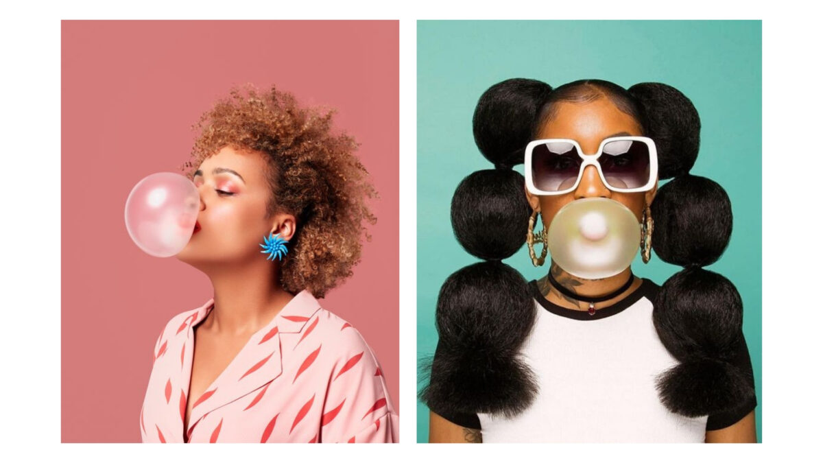 A Woman Blowing Bubble Gum While Another Woman Blows Bubble Gum, Showcasing Fun And Playful Props For A Photoshoot.