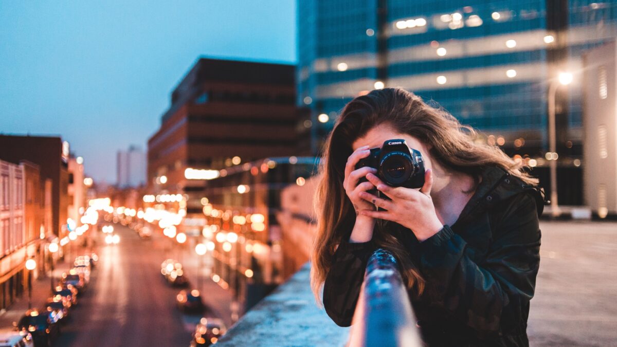 A Woman Making Mistakes As A Photographer While Capturing A City At Night.