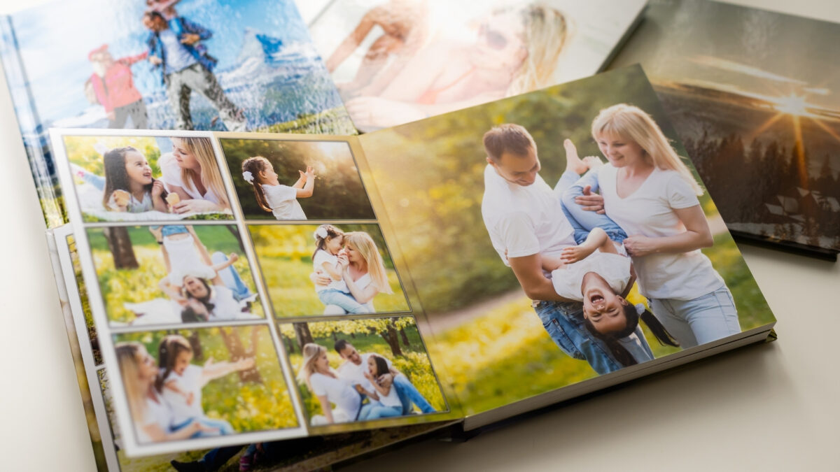 A Photo Book To Store And Backup Photos Of A Family Sitting On A Table.