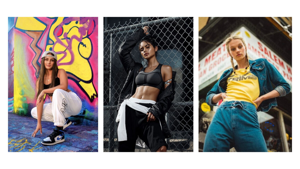 Four Women Are Striking Stylish Poses In Front Of Urban Graffiti.