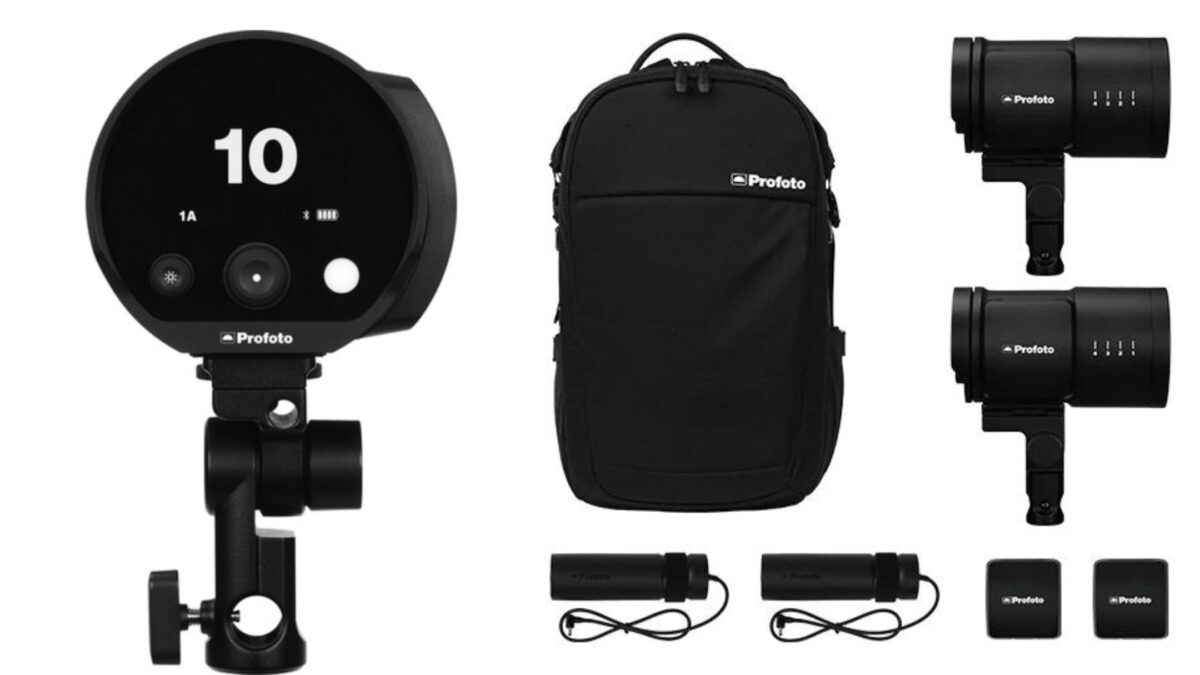 A Black Bag With A Camera, Flash, And Photography Lighting Kit.